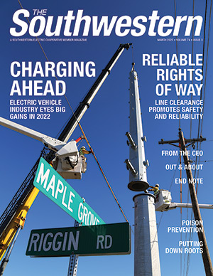 March 2022 Cover of crews building transmission line
