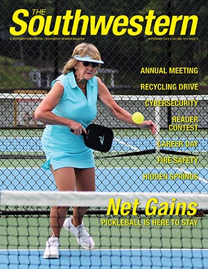 Southwestern September cover image of a paddleball player returning a serve